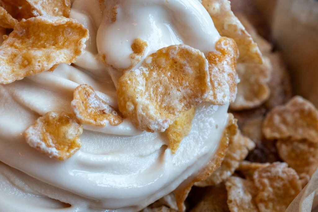 Delicious swirled ice cream topped with crunchy cereal flakes, a perfect dessert treat.